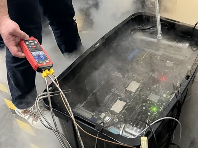 Early immersion test with a server board submerged in fluid